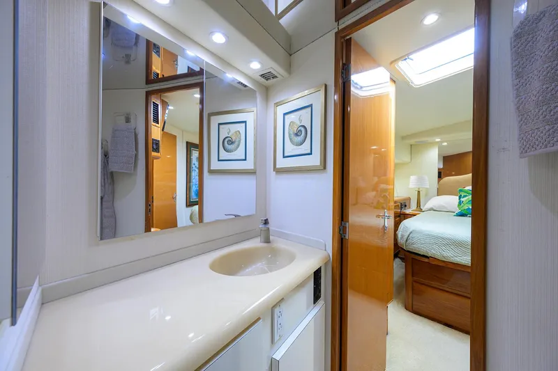 Slide: The Image of Luxurious bathroom and bedroom interior of a 1998 Viking 53 Convertible yacht. - 38