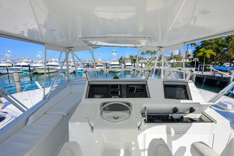 Slide: The Image of Cockpit view of 1998 Viking 53 Convertible yacht docked at a marina. - 43