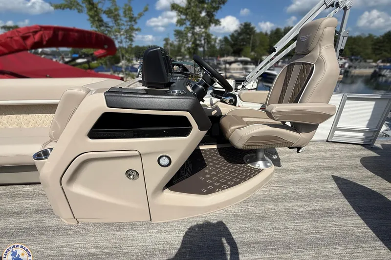 Slide: The Image of 2025 Bennington 22ML boat helm with luxurious captain's chair and modern controls. - 11