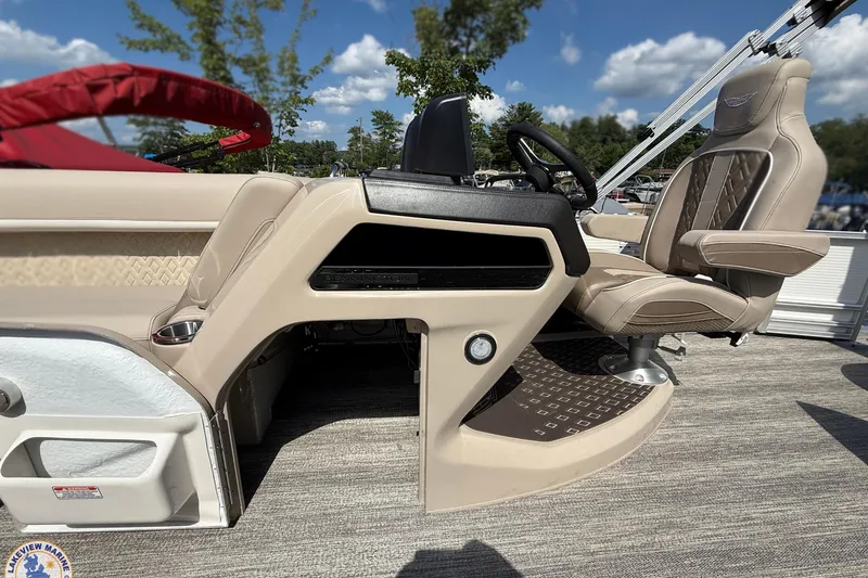 Slide: The Image of 2025 Bennington 22ML boat interior with captain's chair and steering console. - 12