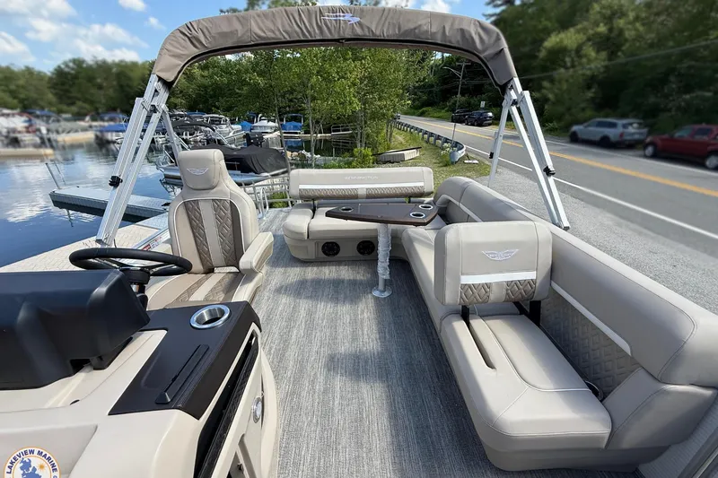 Slide: The Image of Luxurious 2025 Bennington 22ML pontoon boat interior with plush seating and modern design. - 13