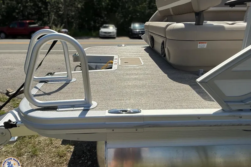 Slide: The Image of 2025 Bennington 22ML pontoon boat with spacious deck and seating area. - 4