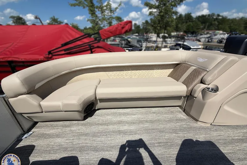 Slide: The Image of Luxurious seating on 2025 Bennington 22ML pontoon boat, featuring elegant beige upholstery. - 6