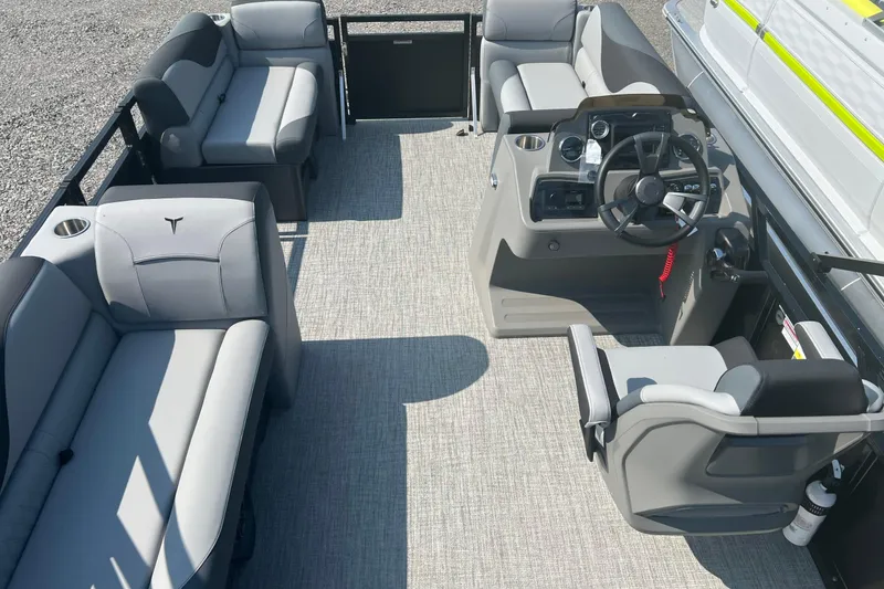 Slide: The Image of 2026 Tahoe Pontoon 1980 CRUISE interior with gray seating and steering console. - 13
