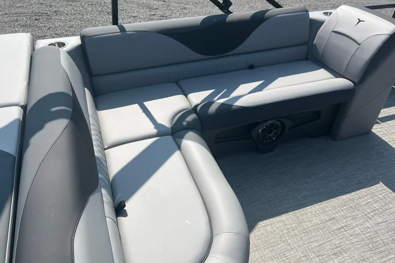 Slide: The Image of 2026 Tahoe Pontoon 1980 CRUISE interior with gray seating and speaker system. - 15
