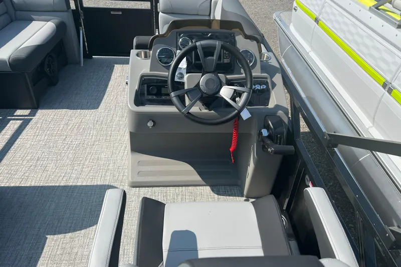 Slide: The Image of 2026 Tahoe Pontoon 1980 CRUISE boat interior with steering console and seating. - 16