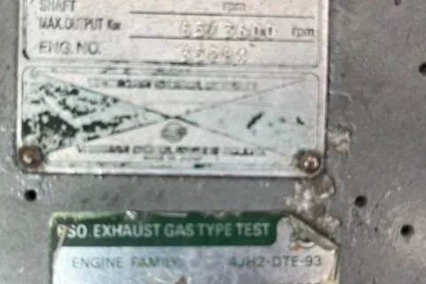 Slide: The Image of Close-up of engine specifications on a 1985 Albin 27 Family boat. - 5