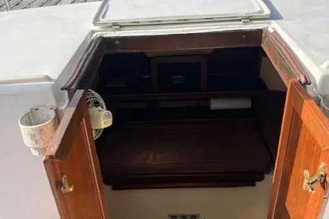 Slide: The Image of 1985 Albin 27 Family boat cabin entrance with open wooden doors. - 8