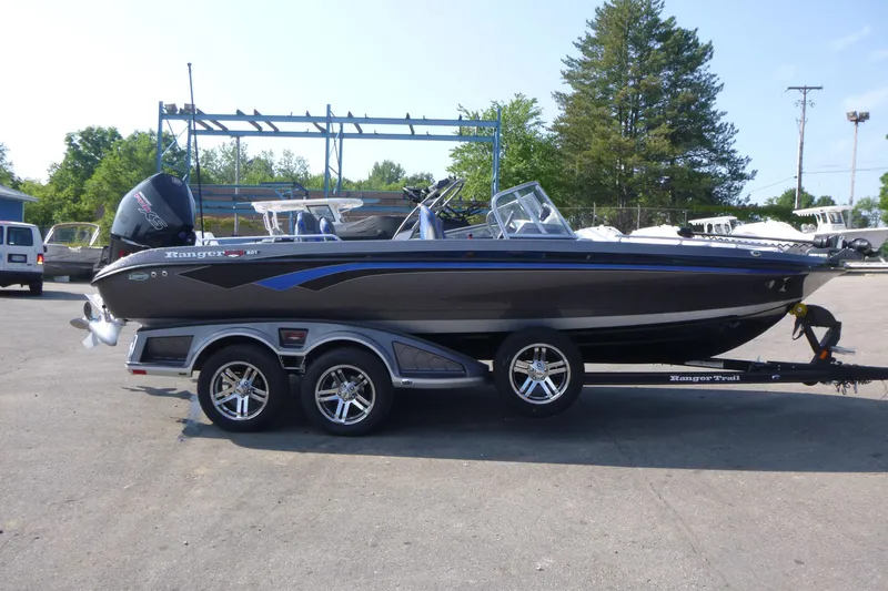Slide: The Image of 2024 Ranger 621FS Ranger Cup Equipped boat on trailer, parked outdoors. - 1