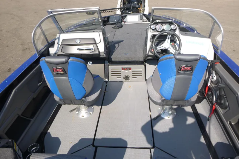 Slide: The Image of 2024 Ranger 621FS Ranger Cup boat interior with blue seats and control panel. - 5