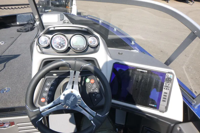 Slide: The Image of 2024 Ranger 621FS Ranger Cup Equipped boat dashboard with steering wheel and navigation system. - 7