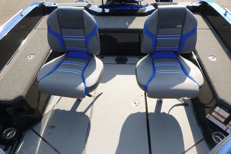Slide: The Image of 2024 Ranger 621FS Ranger Cup boat interior with two blue and gray seats. - 8