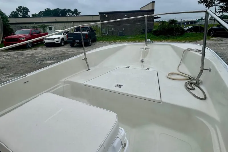 Slide: The Image of Interior view of a 1993 Boston Whaler 17 Montauk boat, showcasing seating and storage. - 3