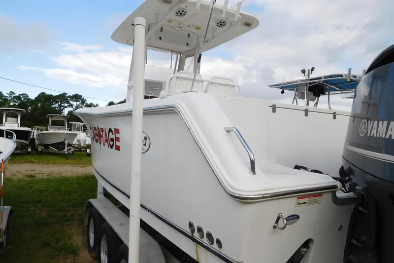 Slide: The Image of 2013 Sea Hunt Gamefish 27 boat with Yamaha engine, parked on a trailer. - 1