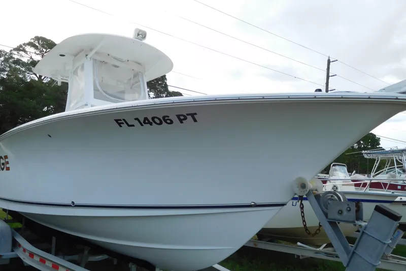 Slide: The Image of 2013 Sea Hunt Gamefish 27 boat on trailer, side view with registration number FL 1406 PT. - 3