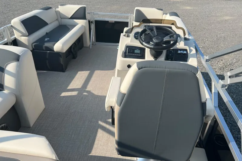 Slide: The Image of 2026 Tahoe Pontoon 1780 CRB interior with steering console and seating. - 10