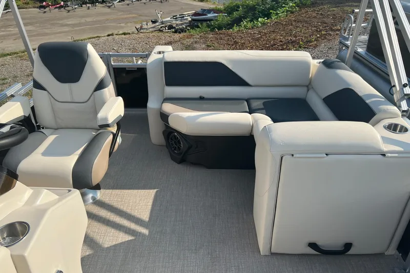 Slide: The Image of Luxurious seating on 2026 Tahoe Pontoon 1780 CRB, featuring plush beige and black upholstery. - 17