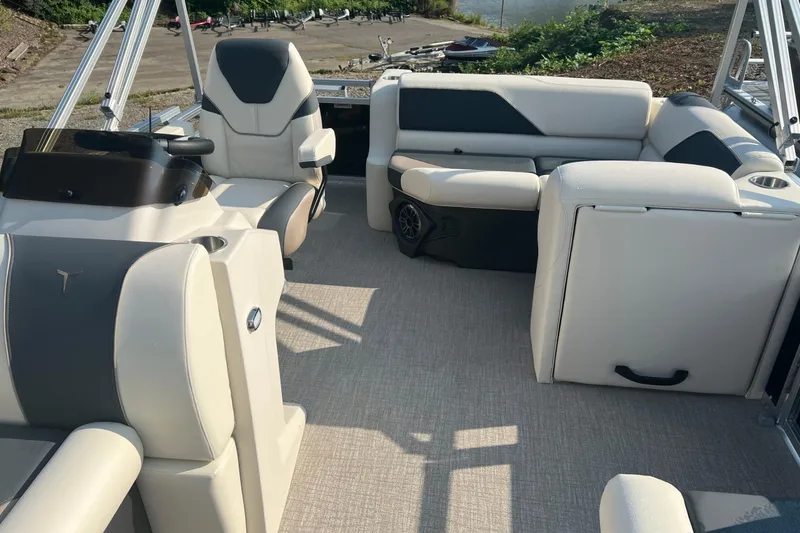 Slide: The Image of 2026 Tahoe Pontoon 1780 CRB interior with plush seating and modern design. - 19