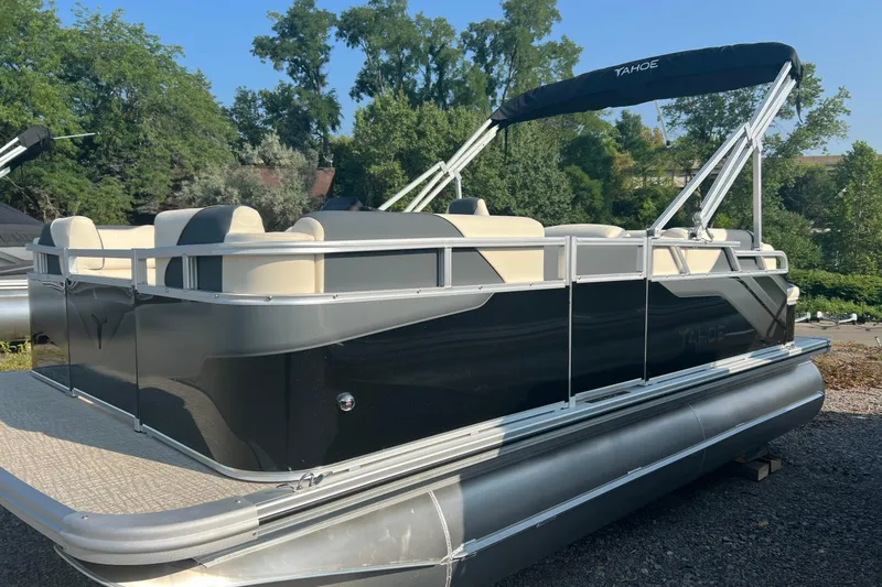 Slide: The Image of 2026 Tahoe Pontoon 1780 CRB, sleek black design, spacious seating, outdoor setting. - 3