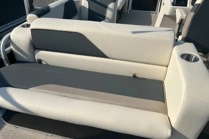 Slide: The Image of 2026 Tahoe Pontoon 1780 CRB boat interior with cushioned seating and cup holder. - 7