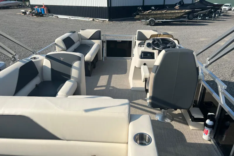 Slide: The Image of 2026 Tahoe Pontoon 1780 CRB interior with seating and steering console. - 8