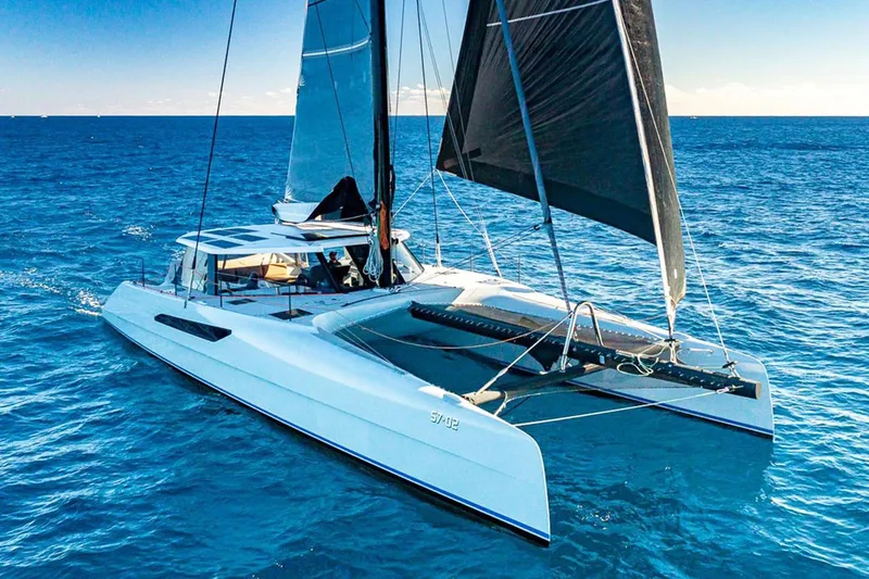The Image of 2018 Gunboat 57 catamaran sailing on open blue ocean waters. - 0