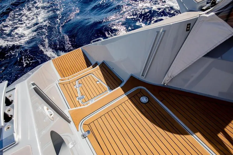 Slide: The Image of Gunboat 57 (2018) yacht deck with teak flooring, sailing on open ocean. - 14