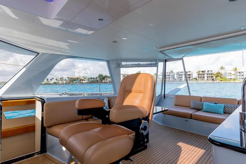 Slide: The Image of Luxurious interior of 2018 Gunboat 57 yacht with leather seating and ocean view. - 23