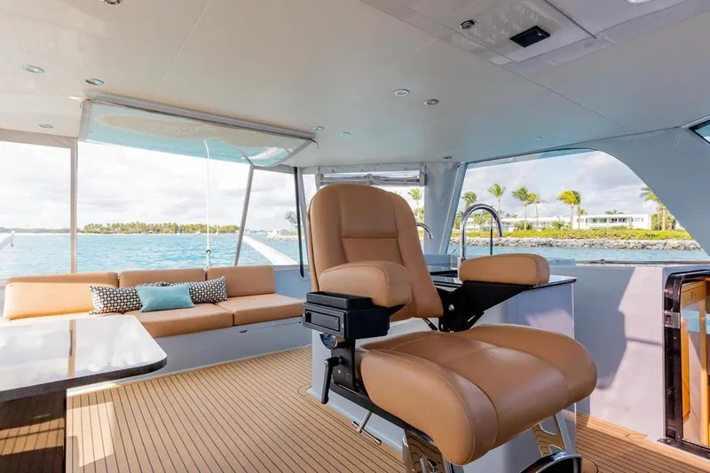 Slide: The Image of Luxurious interior of 2018 Gunboat 57 yacht with leather seating and ocean view. - 24