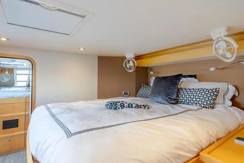 Slide: The Image of Luxurious bedroom interior of 2018 Gunboat 57 yacht with cozy bedding and modern lighting. - 36