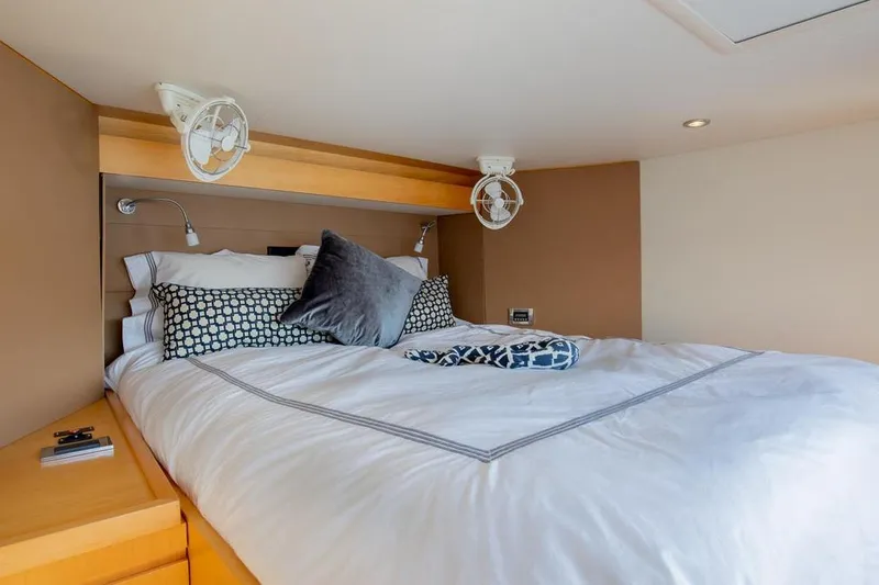 Slide: The Image of Luxurious bedroom interior of 2018 Gunboat 57 yacht with cozy bedding and modern lighting. - 38