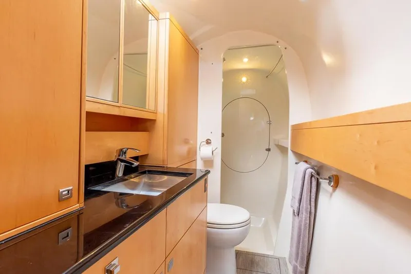Slide: The Image of Luxurious bathroom in 2018 Gunboat 57 yacht with modern fixtures and wooden cabinetry. - 39