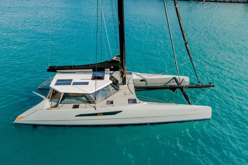 Slide: The Image of 2018 Gunboat 57 catamaran sailing on clear turquoise waters. - 4