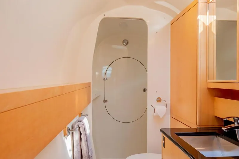 Slide: The Image of Luxurious bathroom in 2018 Gunboat 57 yacht with modern fixtures and wooden cabinetry. - 41