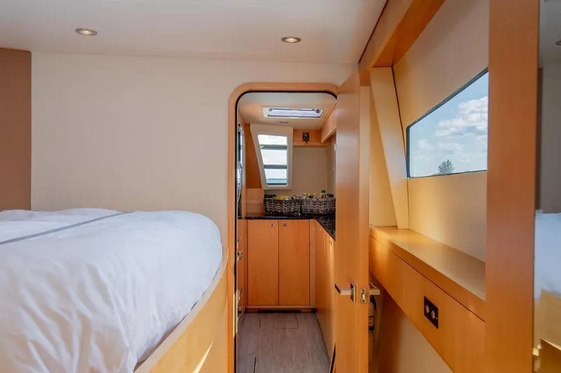 Slide: The Image of Interior of 2018 Gunboat 57 yacht featuring cozy bedroom and modern cabinetry. - 42