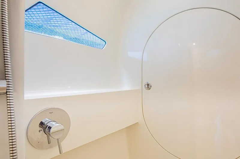 Slide: The Image of Interior of 2018 Gunboat 57 yacht, featuring sleek white design and modern fixtures. - 47