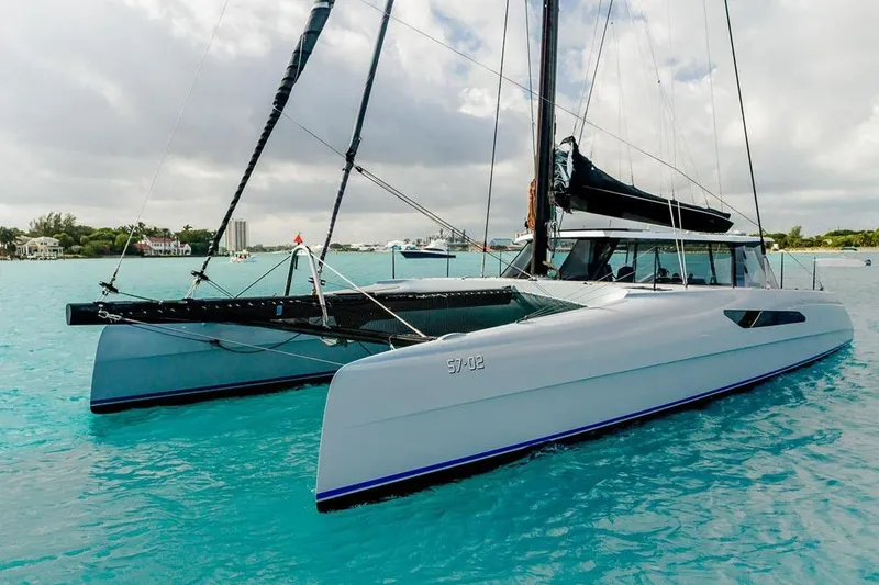 Slide: The Image of 2018 Gunboat 57 catamaran sailing on turquoise waters under cloudy skies. - 5