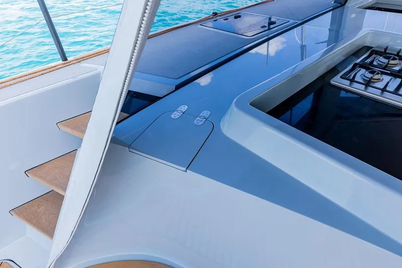 Slide: The Image of Modern Gunboat 57 yacht interior with sleek kitchen and wooden steps, 2018 model. - 51