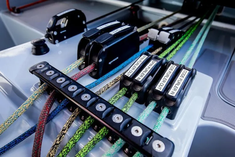 Slide: The Image of Close-up of colorful ropes and cleats on a 2018 Gunboat 57 sailboat. - 55