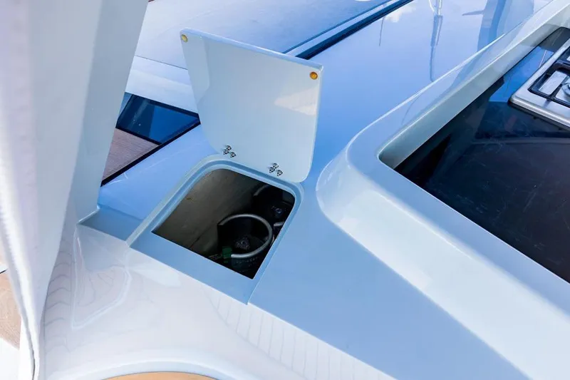 Slide: The Image of 2018 Gunboat 57 yacht deck detail with open storage compartment. - 57