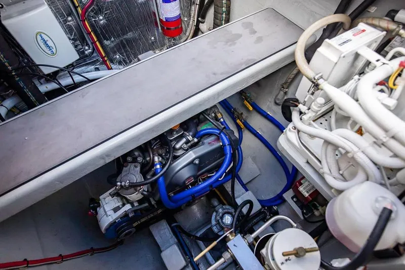 Slide: The Image of Engine room of 2018 Gunboat 57 yacht, showcasing mechanical components and wiring. - 60