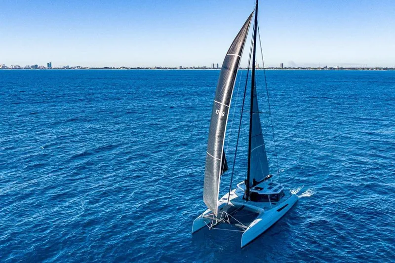 Slide: The Image of 2018 Gunboat 57 sailing on open blue ocean under clear sky. - 62