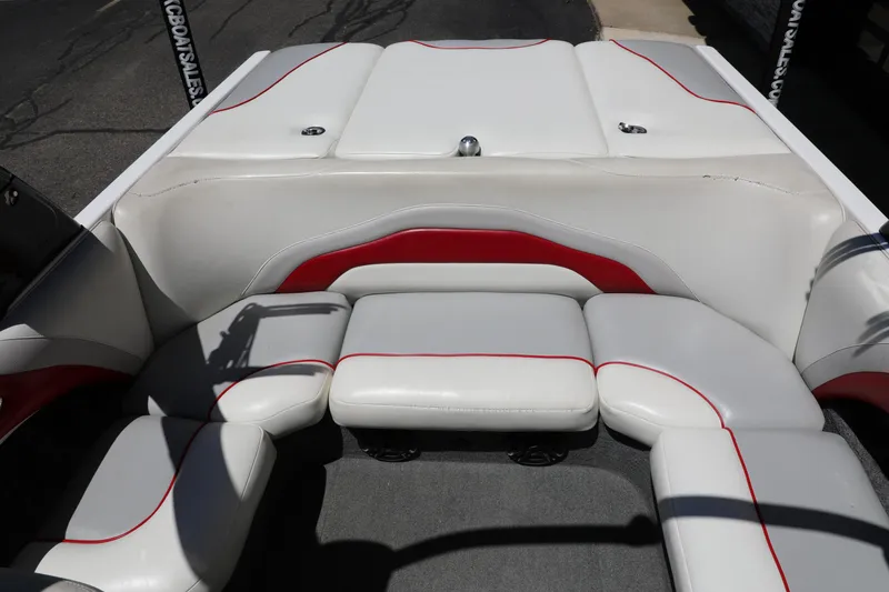 Slide: The Image of 2008 Malibu 21 vRide boat interior with white and red seating. - 11