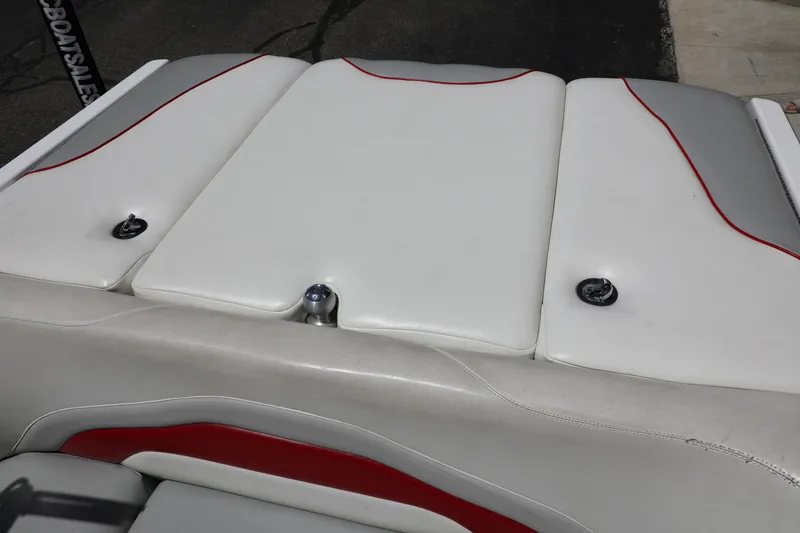 Slide: The Image of 2008 Malibu 21 vRide boat interior with white and red upholstery details. - 14