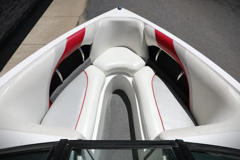 Slide: The Image of 2008 Malibu 21 vRide boat interior with white and red seating. - 6