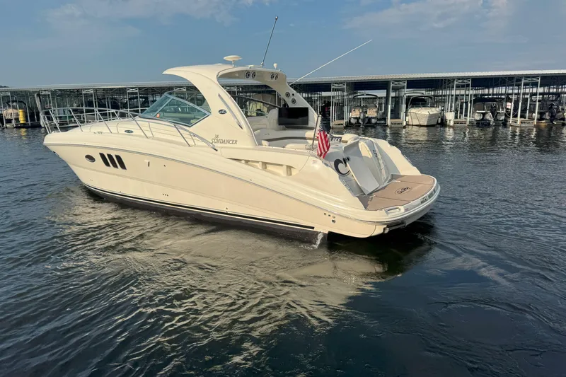 Slide: The Image of 2006 Sea Ray 380 Sundancer yacht docked in marina, sunny day. - 1