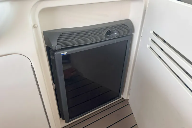 Slide: The Image of Mini fridge on 2006 Sea Ray 380 Sundancer yacht, interior view. - 23