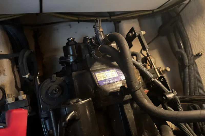 Slide: The Image of Engine compartment of a 2006 Sea Ray 380 Sundancer with visible wiring and components. - 27