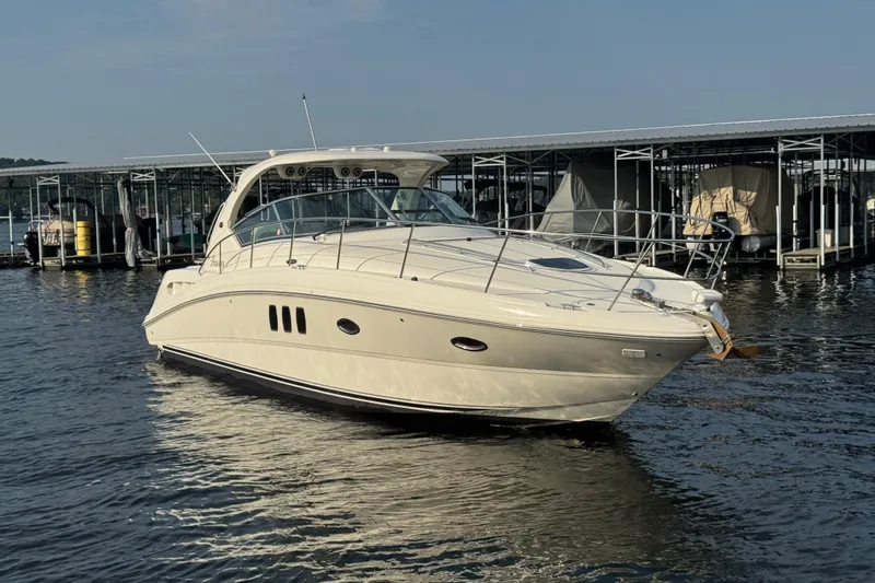 Slide: The Image of 2006 Sea Ray 380 Sundancer yacht docked on calm water. - 3