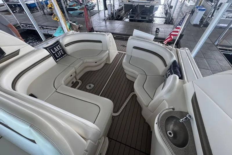 Slide: The Image of Luxurious seating area on a 2006 Sea Ray 380 Sundancer yacht with "Lake Life" pillow. - 8